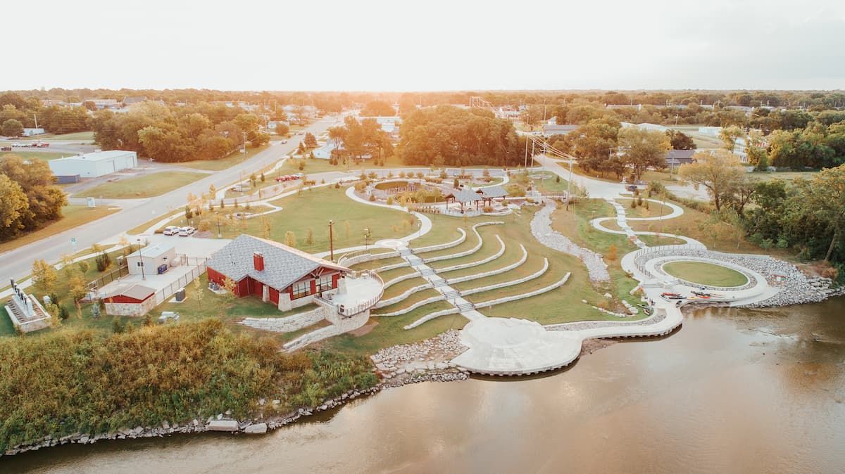 An aerial view of Warren Riverview Park's terraced amphitheater and river landing along the Arkansas River