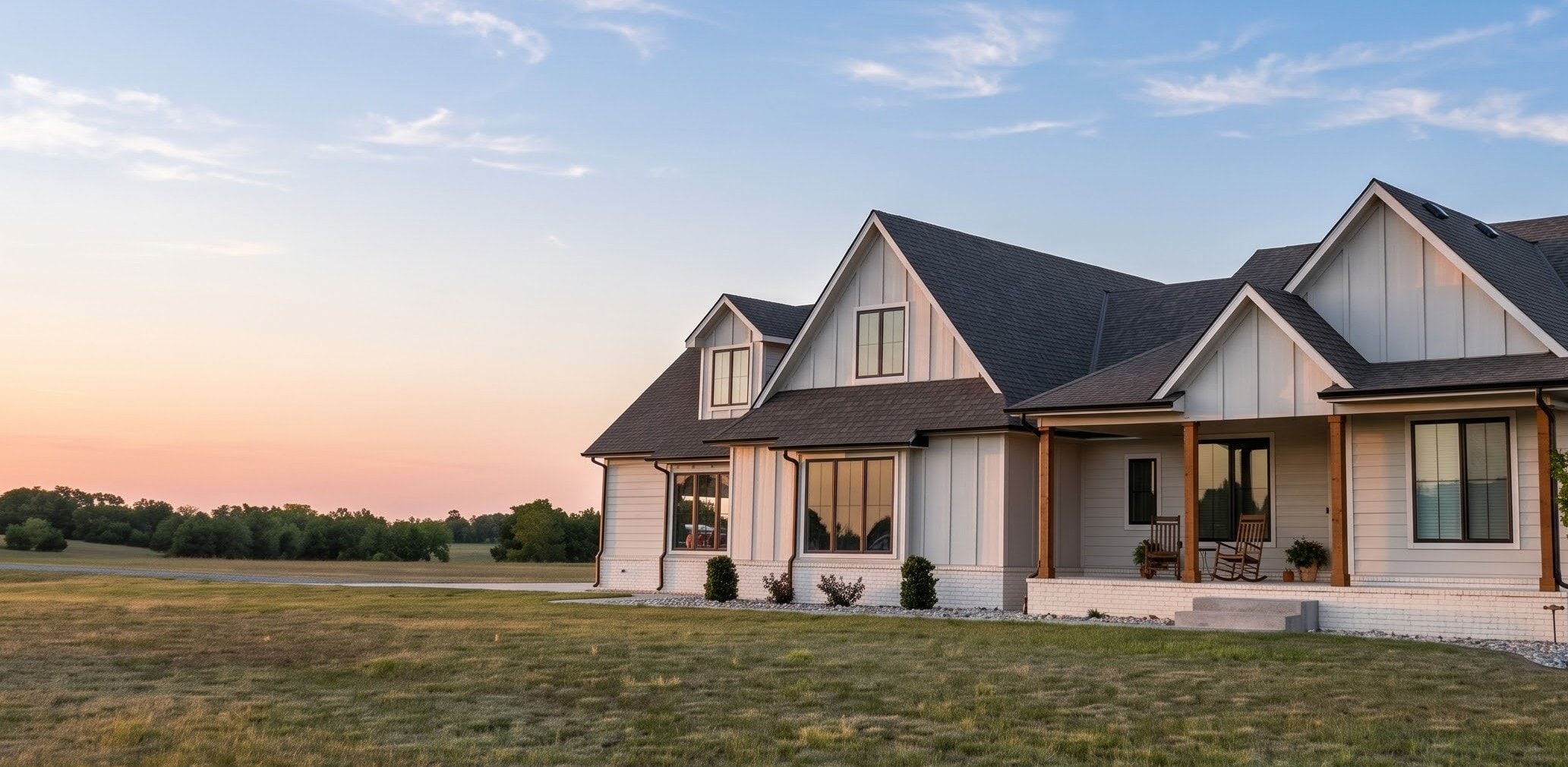 A welcoming home overlooking open Kansas fields at sunset